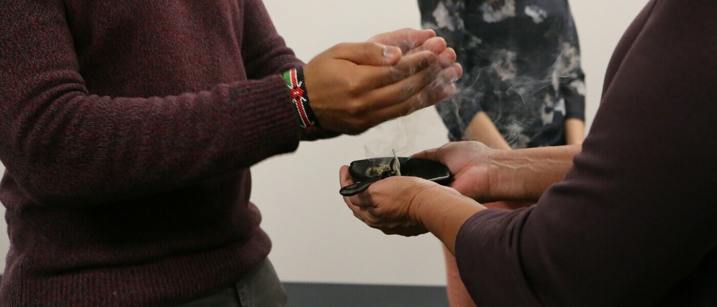 The hands of two people smudging together